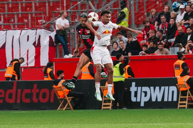 September 20, 2026, xjmrgnx, Soccer, Bundesliga 1, Bayer 04 Leverkusen vs. RB Leipzig: Heading duel between Facundo Medina (2), Leverkusen, and Tidiam Gomis (27), Leipzig. DFL and DFB regulations prohibit any use of photographs as image sequences and or quasi-video. Leverkusen