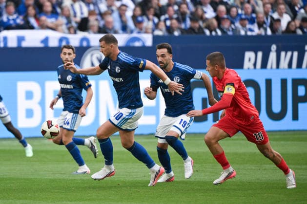 Edin Dzeko, FC Schalke 04; Kenan Karaman, FC Schalke 04; Lukas Pinckert, SV Elversberg; from left, September 20, 2026; Soccer, 1. Bundesliga, 2026–2027 season, Matchday 4, FC Schalke 04 vs. SV Elversberg. DFL regulations prohibit any use of photographs as image sequences and or quasi-video. Gelsenkirchen, Veltins Arena, North Rhine-Westphalia, Germany Team2