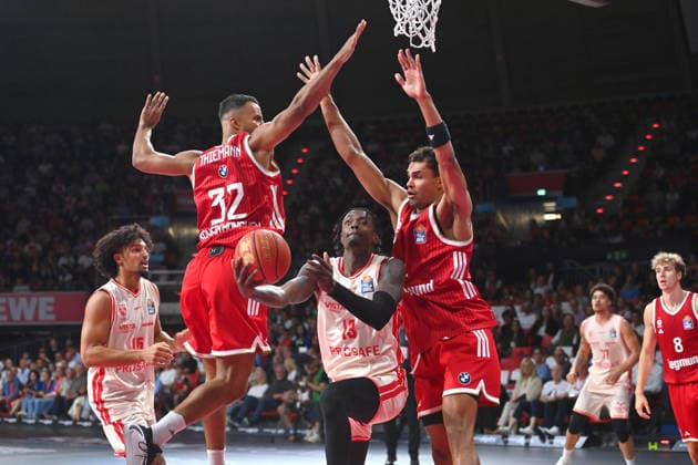 From left: Johannes THIEMANN (FCB), Trevon SCOTT (BA), Johannes THIEMANN (FCB) in action; a basketball matchup in the BBL, 2026–2027 season, FC Bayern Munich vs. Bamberg Baskets on September 20, 2026, at BMW Park