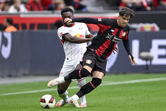 LEVERKUSEN - (lr) Ridle Baku or RB Leipzig, Alfonso Moreira or Bayer 04 Leverkusen during the match between Bayer 04 Leverkusen and RB Leipzig at the Bay Arena on 20 September 2026 in Leverkusen, Germany. ANP Bundesliga 2026 27 xVIxANPxSportx xGerritxvanxKeulenxIVx 569419482 originalFilename: 569419482.jpg