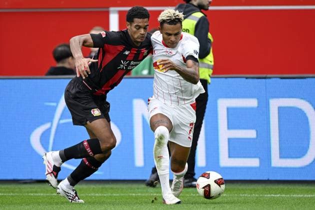 LEVERKUSEN - (lr) Jarell Quansah of Bayer 04 Leverkusen, Antonio Nusa of RB Leipzig during the match between Bayer 04 Leverkusen and RB Leipzig at the Bay Arena on 20 September 2026 in Leverkusen, Germany. ANP Bundesliga 2026 27 xVIxANPxSportx xGerritxvanxKeulenxIVx 569419513 originalFilename: 569419513.jpg
