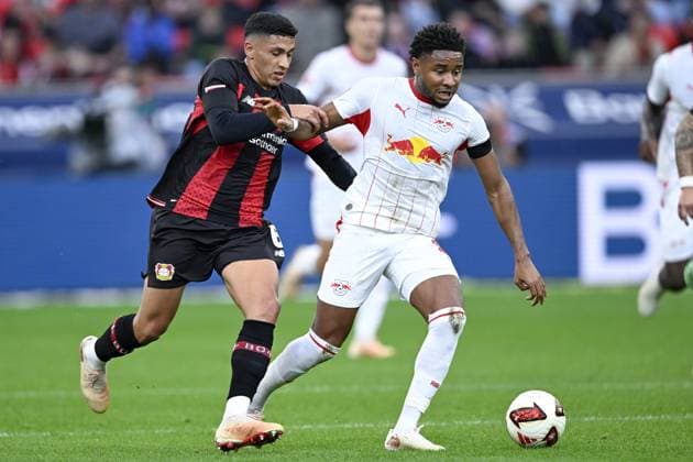 LEVERKUSEN - (lr) Ezequiel Fernandez of Bayer 04 Leverkusen, Christopher Nkunku of RB Leipzig during the match between Bayer 04 Leverkusen and RB Leipzig at the Bay Arena on 20 September 2026 in Leverkusen, Germany. ANP Bundesliga 2026 27 xVIxANPxSportx xGerritxvanxKeulenxIVx 569419562 originalFilename: 569419562.jpg