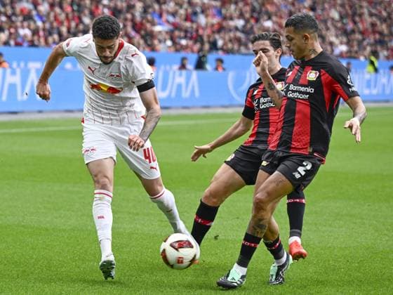 LEVERKUSEN - (lr) Romulo of RB Leipzig, Miquel Gutierrez of Bayer 04 Leverkusen, Facundo Medina of Bayer 04 Leverkusen during the match between Bayer 04 Leverkusen and RB Leipzig at the Bay Arena on 20 September 2026 in Leverkusen, Germany. ANP Bundesliga 2026 27 xVIxANPxSportx xGerritxvanxKeulenxIVx 569419685 originalFilename: 569419685.jpg