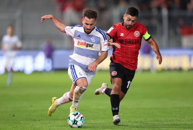 September 20, 2026, Soccer 3rd Division, SV Wehen Wiesbaden vs. MSV Duisburg, from left: Can Coskun (MSV Duisburg), Tarik Gözüsirin (SV Wehen Wiesbaden). DFL and DFB regulations prohibit any use of photographs as image sequences and or quasi-video. xdcx Copyright: HMBxMedia Claus