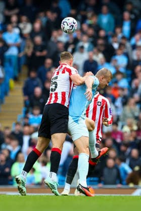 20th September 2026; Etihad Stadium, Manchester, England; Premier League Football, Manchester City versus Sunderland; Daniel Ballard of Sunderland beats Erling Haaland of Manchester City to the high ball RogerxEvans