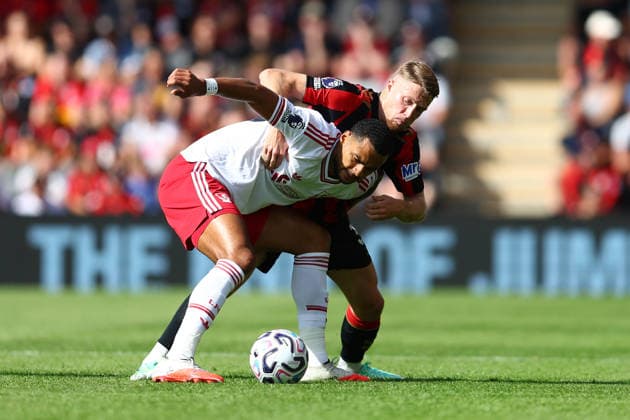 Bournemouth, England, 20th September 2026. Cody Gakpo of Liverpool and Adrien Truffert of AFC Bournemouth challenge for the ball during the AFC Bournemouth vs Liverpool Premier League match at the Vitality Stadium, Bournemouth. Picture credit should read: Paul Terry Sportimage EDITORIAL USE ONLY. No use with unauthorised audio, video, data, fixture lists, club league logos or live services. Online in-match use limited to 120 images, no video emulation. No use in betting, games or single club league player publications. SPI_066_PT_Bournemouth_Liverpool SPI-5013-0064