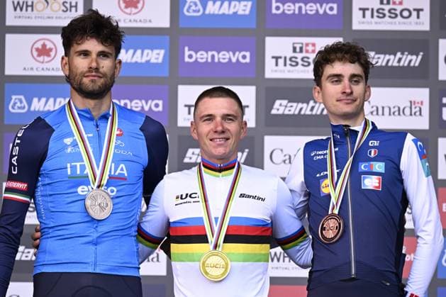 L-R, silver medalist, Italy s Filippo Ganna; winner world champion Belgium s Remco Evenepoel and bronze medalist France s Paul Seixas celebrate on the podium of the men s elite individual time trial race (39,2km) at the cycling UCI Road World Championship, WM, Weltmeisterschaft in Montreal, Canada, Sunday 20 September 2026. JASPERxJACOBS  x187204277x