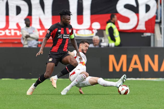 Edmond Tapsoba of Bayer 04 Leverkusen and Romulo of RB Leipzig battle for the ball during the Bundesliga match between Bayer 04 Leverkusen and RB Leipzig, BayArena on September 20, 2026, in Leverkusen, Germany. Photo by Oliver Kaelke, DeFodi Images. Edmond Tapsoba of Bayer 04 Leverkusen and Romulo of RB Leipzig battle for the ball during the Bundesliga match between Bayer 04 Leverkusen and RB Leipzig at BayArena on September 20, 2026 in Leverkusen, Germany. Photo by Oliver Kaelke, DeFodi Images. DFB and DFL regulations prohibit any use of photographs as image sequences and or quasi-video. Photo by Oliver Kaelke, DeFodi Images.