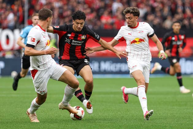 Maxime Esteve (RB Leipzig), Ibrahim Maza (Bayer 04 Leverkusen), and Neil El Aynaoui (RB Leipzig) in a tackle during the Bundesliga 1 match between Bayer 04 Leverkusen and RB Leipzig, BayArena on September 20, 2026, in Leverkusen, Germany. Photo by Oliver Kaelke, DeFodi Images. Maxime Esteve (RB Leipzig), Ibrahim Maza (Bayer 04 Leverkusen) and Neil El Aynaoui (RB Leipzig) battle for the ball during the Bundesliga match between Bayer 04 Leverkusen and RB Leipzig at BayArena on September 20, 2026 in Leverkusen, Germany. Photo by Oliver Kaelke, DeFodi Images. DFB and DFL regulations prohibit any use of photographs as image sequences and or quasi-video. Photo by Oliver Kaelke, DeFodi Images