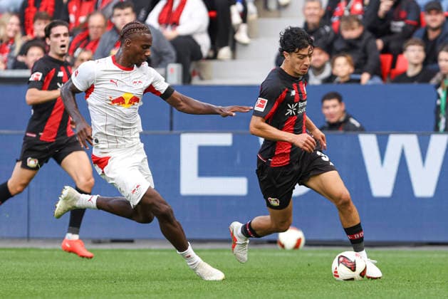 Ezechiel Banzuzi of RB Leipzig and Ibrahim Maza of Bayer 04 Leverkusen battle for the ball during the Bundesliga match between Bayer 04 Leverkusen and RB Leipzig at BayArena on September 20, 2026, in Leverkusen, Germany. Photo by Oliver Kaelke, DeFodi Images. Ezechiel Banzuzi of RB Leipzig and Ibrahim Maza of Bayer 04 Leverkusen battle for the ball during the Bundesliga match between Bayer 04 Leverkusen and RB Leipzig at BayArena on September 20, 2026 in Leverkusen, Germany. Photo by Oliver Kaelke, DeFodi Images. DFB and DFL regulations prohibit any use of photographs as image sequences and or quasi-video. Photo by Oliver Kaelke, DeFodi Images