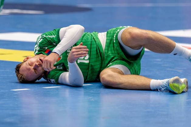 Düsseldorf, September 20, 2026, Handball, Men s, Opel Bundesliga, Matchday 5, 2026–2027 Bergische HC vs. Füchse Berlin, Mathias Gidsel of Füchse Berlin lies on the floor, his face contorted with pain
