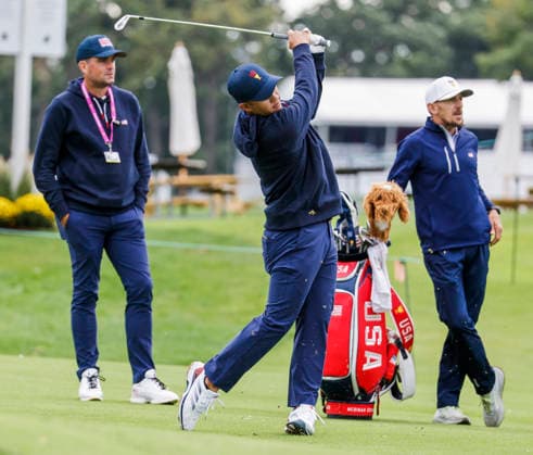 US team assistant captain Keegan Bradley (L) watches as Colin Morikawa of the US hits on the fourteenth hole during practice for the Presidents Cup golf tournament at Medinah Country Club in Medinah, Illinois on Monday, September 21, 2026. Competition between the USA and the International team begins on Thursday, September 24 with Four-Ball play.  MED20260922803 TANNENxMAURY