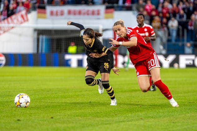 Yui Hasegawa, 25, of Manchester, and Franziska Kett, 20, of Bayern, in action during the UEFA Women s Champions League match between FC Bayern Munich and Manchester City on September 22, 2026, at uhlsport PARK in Unterhaching, Bavaria, Germany