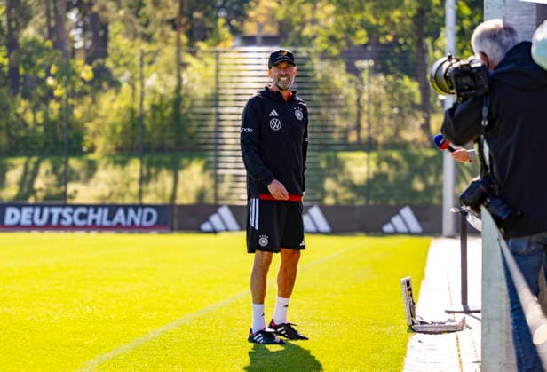 September 23, 2026, DFB German National Soccer Team, training camp in Herzogenaurach, at ADIDAS’s home ground, ahead of the UEFA Nations League matches; German national team coach Jürgen Klopp briefly stops to speak with reporters on the sidelines while his players continue training