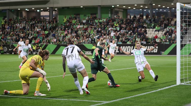Here, Svenja Huth of VfL Wolfsburg scores the 4-0 goal against Sarah Lisa Duebel and Lilla Sipos of SK Sturm Graz, with Merel Bormans of SK Sturm Graz on the right. Soccer, Women s, 2026–2027 Season, UEFA Women’s Europa League Qualifiers, Round 2, AOK Stadium Wolfsburg, VfL Wolfsburg vs. Sturm Graz