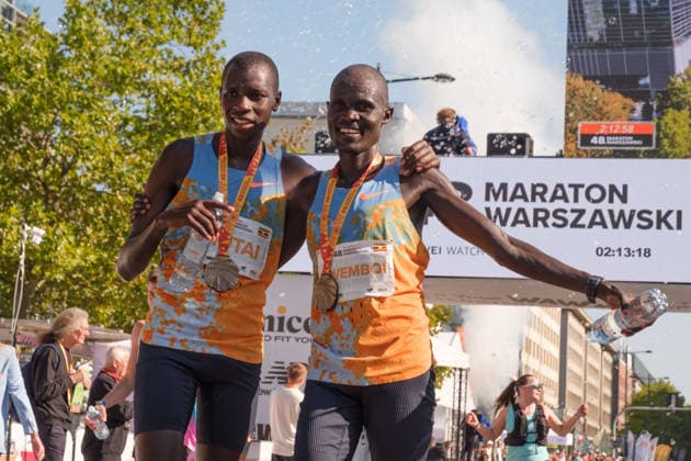 September 27, 2026, Warsaw, Masovian Voivodeship, Poland: 2nd place VICTOR KWEMBOI and 3rd place EZEKIEL MUTAI (both of Uganda) celebrate at the finish line of the 48th Warsaw Marathon. The race has been awarded the World Athletics Elite Label for the first time in its history and is part of the European Marathon Classics (EMC) series of races. Warsaw Marathon 2026  - ZUMAk204 20260927_zip_k204_026 Copyright: xRomanxKozielx