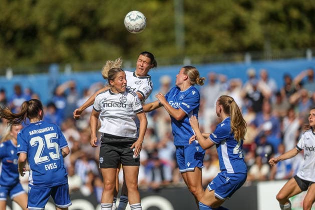 GER, Karlsruhe, Karlsruher SC vs. Eintracht Frankfurt SC, DFB Women s Cup, Soccer, DFB, 2026–2027 Season, Badenia Stadium, 1st Round (pictured, from left): Emily Evels (Karlsruher SC Women s 25), Danique Tolhoek, Eintracht Frankfurt Women’s Team 22, Larissa Mühlhaus, Eintracht Frankfurt Women’s Team 47. DFB and DFL regulations prohibit any use of photographs as image sequences and or quasi-video. September 27, 2026 Copyright: HMBxMedia HendrikxHamelau
