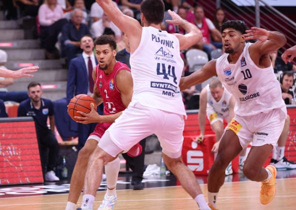 Alijah Comithier of Bonn takes the ball against Jure Planinic of MBC and Kostja Mushidi of MBC, Bonn, Germany, September 27, 2026, Basketball Bundesliga, Matchday 3, Telekom Baskets Bonn vs. Syntainics MBC
