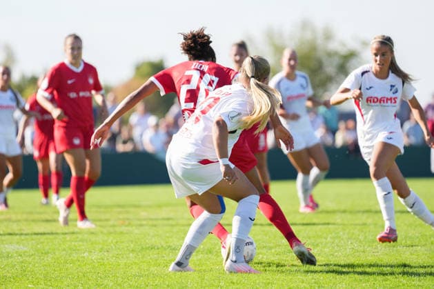 DFB Women s Cup: SC Sand vs. VfL Wolfsburg, September 27, 2026. A tackle between Kim Schneider (SC Sand, No. 8) and Cora Zicai (VfL Wolfsburg, No. 28). DFB Women s Cup: SC Sand vs. VfL Wolfsburg, Adams Arena, September 27, 2026 DFB and DFL regulations prohibit any use of photographs as image sequences and or quasi-video Copyright: xBEAUTIFULxSPORTS Boscox