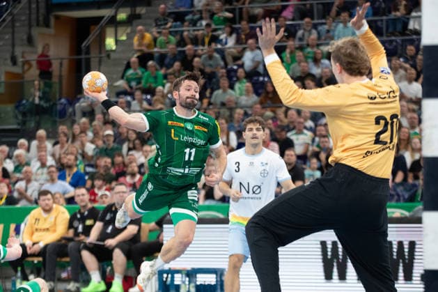 Handball, HBL2 SC DHfK Leipzig vs. TSV Bayer Dormagen, September 27, 2026; Lukas Binder 11, SC DHfK Leipzig shoots against goalkeeper Christian Simonsen 20, Bayer Dormagen; Handball, 2nd Bundesliga, 2026–2027 season, Matchday 5: SC DHfK Leipzig vs. TSV Bayer Dormagen on September 27, 2026, at the Quarterback Immobilien Arena Leipzig Copyright: xBEAUTIFULxSPORTS JanxKaeferx