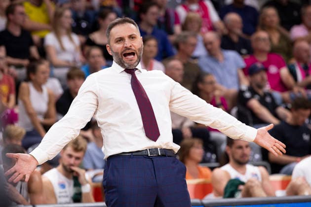 Head Coach Vladimir JOVANOVIC of MBC, visibly excited, raises his arms in celebration; final score 77–72, Basketball 1st Bundesliga: Telekom Baskets Bonn vs. Syntainics MBC from Weissenfeld (Weißenfels), BON vs. MBC, regular season, Matchday 3, at the TELEKOM DOME, on September 27, 2026, Â