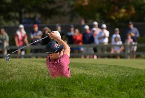 Justin Thomas of the United States hits out of a bunker on the second fairway during a singles match on the final day of the 2026 President s Cup golf tournament at Medinah Country Club in Chicago, Illinois, on Sunday, September 27, 2026.  CHI20260927722 MARKxBLACK