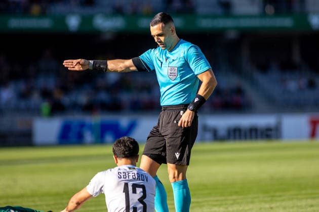 UEFA National League - League - Round 2 Lithuania Dariaus ir Gineno stadionas Referee Menelaos Antoniou instructs an Azerbaijan player to stand up during the UEFA Nations League match between Lithuania and Azerbaijan at Dariaus ir Gireno Stadium in Kaunas, Lithuania, on September 27, 2026. Kaunas Kaunas Lithuania