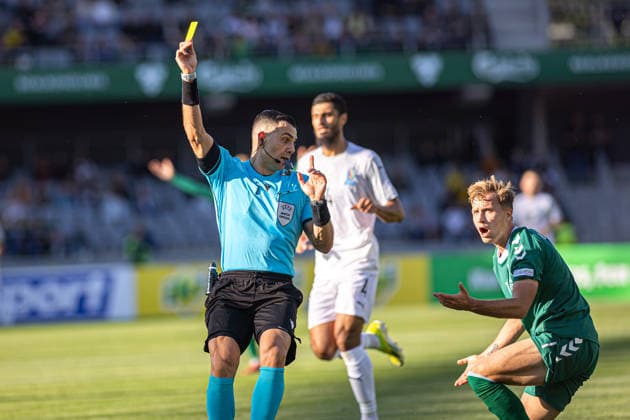 UEFA National League - League - Round 2 Lithuania Dariaus ir Gineno stadionas Menelaos Antoniou shows a yellow card to Rahil Mammadov during the UEFA Nations League match between Lithuania and Azerbaijan at Dariaus ir Gireno Stadium in Kaunas, Lithuania. Kaunas Kaunas Lithuania
