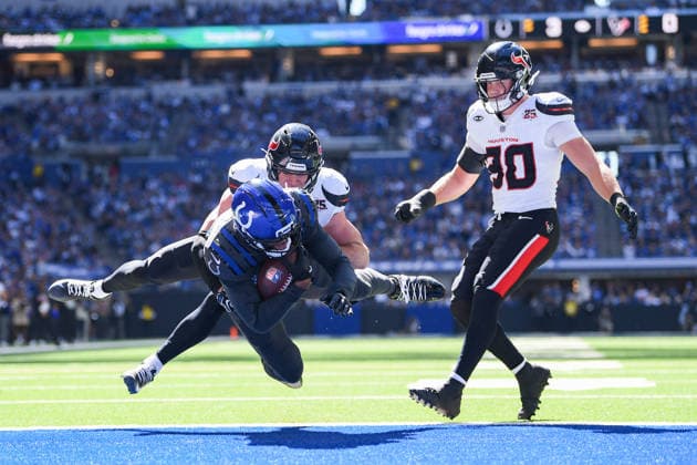 INDIANAPOLIS, IN - SEPTEMBER 27: Houston Texans linebacker Wade Woodaz (30) slows as Indianapolis Colts wide receiver Keenan Allen (10) scores a touchdown as he is tackled by Houston Texans safety Reed Blankenship (6) during the NFL, American Football Herren, USA game between the Houston Texans and the Indianapolis Colts on September 27, 2026, at Lucas Oil Stadium in Indianapolis, Indiana. (Photo by Michael Allio Icon Sportswire) NFL: SEP 27 Texans at Colts EDITORIAL USE ONLY Icon116260927002