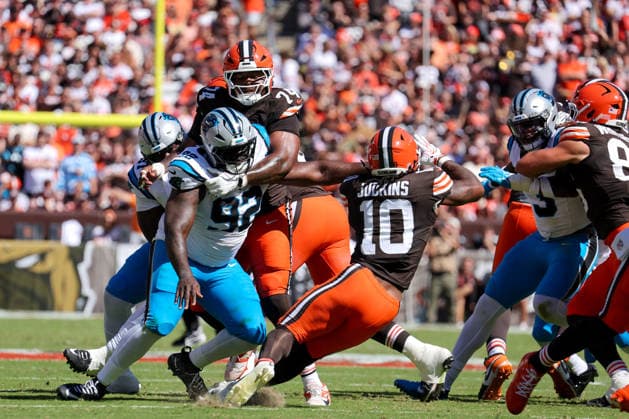 CLEVELAND, OH - SEPTEMBER 27: Cleveland Browns running back Quinshon Judkins (10) carries the football as Cleveland Browns center Elgton Jenkins (74) blocks Carolina Panthers defensive tackle Lee Hunter (92) during the first quarter of the National Football League game between the Carolina Panthers and Cleveland Browns on September 27, 2026, at Huntington Bank Field in Cleveland, OH. (Photo by Frank Jansky Icon Sportswire) NFL, American Football Herren, USA SEP 27 Panthers at Browns EDITORIAL USE ONLY Icon260927008