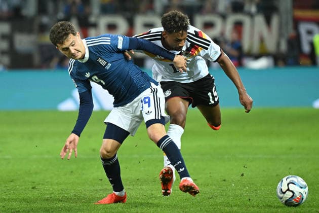 September 27, 2026, xemx, Soccer, UEFA Nations League, Germany vs. Greece, Konstantinos Karetsas, Greece, Bambase Conte, German National Soccer Team (DFB), tackle, action, battle for the ball, Augsburg