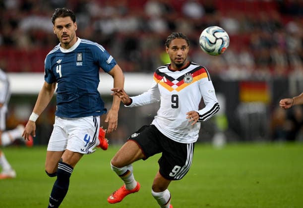 SOCCER UEFA Nations League League A Group 2 2026–2027 in Augsburg, September 27, 2026: Germany vs. Greece—Ntinos Mavropanos (left), Greece, vs. Kevin Schade (right), Germany