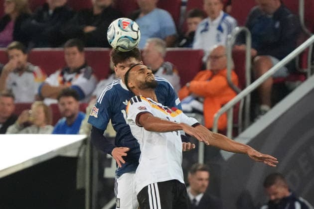 Josha Vagnoman (Germany) in a header duel with Andreas Tetteh (Greece) in Augsburg on September 27, 2026; Germany vs. Greece, UEFA Nations League, WWK Arena, Matchday 2