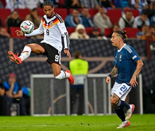 September 27, 2026, Soccer: UEFA Nations League 2026–2027, Matchday 2, Germany vs. Greece, at the WWK Arena in Augsburg, Kevin Schade (Germany) in possession, Kostas Tsimikas (Greece)