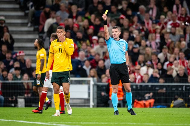 Denmark v Wales, UEFA Nations League, Copenhagen, Denmark Copenhagen, Denmark. 27th, September 2026. Referee Willy Delajod books Brennan Johnson (11) of Wales during the UEFA Nations League match between Denmark and Wales at Parken in Copenhagen. Denmark, Copenhagen, Parken  Copyright: xGonzalesxPhoto TobiasxJorgensenx