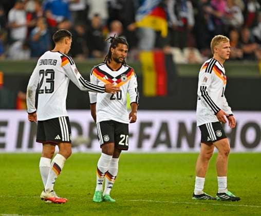September 27, 2026, Soccer: 2026–2027 UEFA Nations League, Matchday 2, Germany vs. Greece, at the WWK Arena in Augsburg; from left: Younes Ebnoutalib (Germany) and Serge Gnabry (Germany) are disappointed