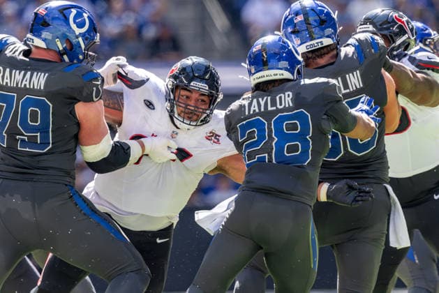 September 27, 2026, Indianapolis, Indiana, U.S: Houston Texans defensive lineman Tommy Togiai (72) fight through the line to tackle Indianapolis Colts running back Jonathan Taylor (28) during the game between the Houston Texans and the Indianapolis Colts at Lucas Oil Stadium, Indianapolis, Indiana. Indianapolis U.S - ZUMAs304 20260927_zaf_s304_004 Copyright: xScottxStuartx