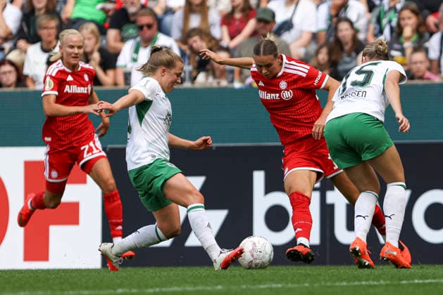 Luca Graf, Borussia Mönchengladbach, Klara Buehl of FC Bayern Munich and Sam Drissen of Borussia Mönchengladbach in a tackle during the DFB Women s Cup match between Borussia Mönchengladbach and FC Bayern Munich at Borussia Park on September 27, 2026, in Mönchengladbach, Germany. Photo by Oliver Kaelke, DeFodi Images. Luca Graf of Borussia Mönchengladbach, Klara Buehl of FC Bayern Munich and Sam Drissen of Borussia Mönchengladbach battle for the ball during the DFB Women’s Cup match between Borussia Mönchengladbach and FC Bayern Munich at ista Borussia Park on September 27, 2026 in Mönchengladbach, Germany Photo by Oliver Kaelke, DeFodi Images DFB and DFL regulations prohibit any use of photographs as image sequences and or quasi-video. Photo by Oliver Kaelke, DeFodi Images