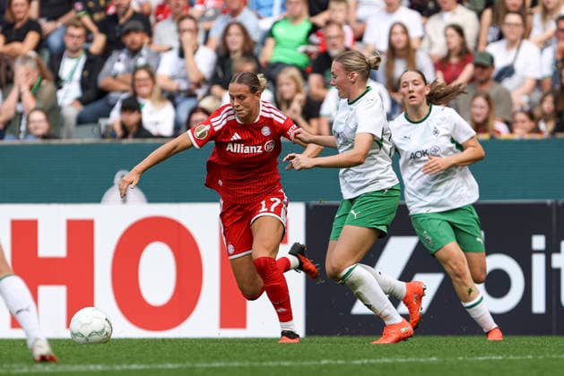 Klara Buehl of FC Bayern Munich and Sam Drissen of Borussia Mönchengladbach in a tackle during the DFB Women s Cup match between Borussia Mönchengladbach and FC Bayern Munich at Borussia Park on September 27, 2026, in Mönchengladbach, Germany. Photo by Oliver Kaelke, DeFodi Images. Klara Buehl of FC Bayern Munich and Sam Drissen of Borussia Mönchengladbach battle for the ball during the DFB Women’s Cup match between Borussia Mönchengladbach and FC Bayern Munich at ista Borussia Park on September 27, 2026 in Mönchengladbach, Germany. Photo by Oliver Kaelke, DeFodi Images. DFB and DFL regulations prohibit any use of photographs as image sequences and or quasi-video. Photo by Oliver Kaelke, DeFodi Images