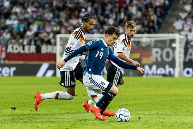 AUGSBURG, GERMANY - SEPTEMBER 27: Konstantinos Karetsas (Greece, 19) controls the ball against Kevin Schade (Germany, 9) during the UEFA Nations League match between Germany vs. Greece at WWK Arena on matchday 2 of the UEFA Nations League on September 27, 2026 in Augsburg, Germany. Bavaria Germany Copyright: xSteffiexWunderlx