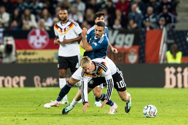 AUGSBURG, GERMANY - SEPTEMBER 27: Jonathan Burkardt (Germany, 10) controls the ball against Dimitris Kourbelis (Greece, 6) during the UEFA Nations League match between Germany vs. Greece at WWK Arena on matchday 2 of the UEFA Nations League on September 27, 2026 in Augsburg, Germany. Bavaria Germany Copyright: xSteffiexWunderlx