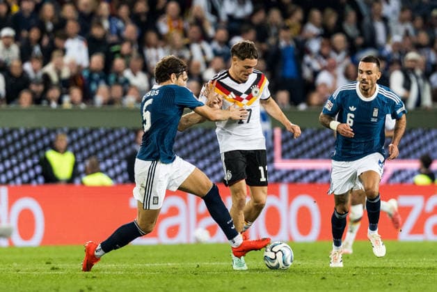 AUGSBURG, GERMANY - SEPTEMBER 27: Florian Wirtz (Germany, 17) controls the ball against Panagiotis Retsos (Greece, 5) during the UEFA Nations League match between Germany vs. Greece at WWK Arena on matchday 2 of the UEFA Nations League on September 27, 2026 in Augsburg, Germany. Bavaria Germany Copyright: xSteffiexWunderlx