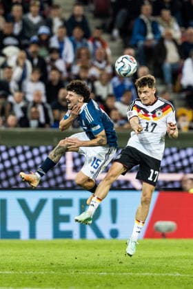 AUGSBURG, GERMANY - SEPTEMBER 27: Florian Wirtz (Germany, 17) controls the ball via header against Thanasis Androutsos (Greece, 15) during the UEFA Nations League match between Germany vs. Greece at WWK Arena on matchday 2 of the UEFA Nations League on September 27, 2026 in Augsburg, Germany. Bavaria Germany Copyright: xSteffiexWunderlx
