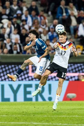 AUGSBURG, GERMANY - SEPTEMBER 27: Florian Wirtz (Germany, 17) controls the ball via header against Thanasis Androutsos (Greece, 15) during the UEFA Nations League match between Germany vs. Greece at WWK Arena on matchday 2 of the UEFA Nations League on September 27, 2026 in Augsburg, Germany. Bavaria Germany Copyright: xSteffiexWunderlx