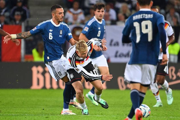 Jonathan BURKARDT (GER), Action, Tackle against Dimitris KOURBELIS (GRE), UEFA Nations League Group Stage, Group B, Matchday 2: Germany (GER) vs. Greece (GRE) 0–1, on September 27, 2026, WWK ARENA AUGSBURG