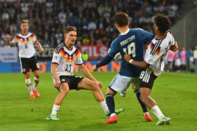 From left: Florian WIRTZ (GER), in action, in a tackle against Konstantinos KARETSAS (GRE); right: Nathaniel BROWN (GER), UEFA Nations League group stage, Group B, Matchday 2: Germany (GER) vs. Greece (GRE) 0–1, on September 27, 2026, at WWK ARENA AUGSBURG