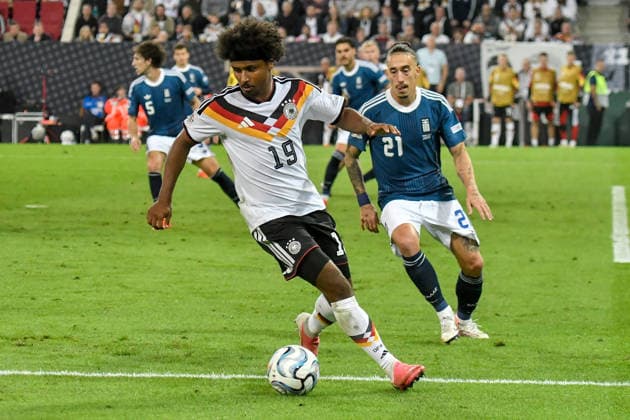 From left in a one-on-one duel: Karim Adeyemi (Germany 19), Kostas Tsimikas (Greece 21), September 27, 2026 ¢ Soccer ¢ Nations League ¢ Germany vs. Greece, WWK Arena, Augsburg, Baden-Württemberg, Germany Copyright: xpepphotox xHorstxMauelshagenx pep00321, pep_20260927_hm
