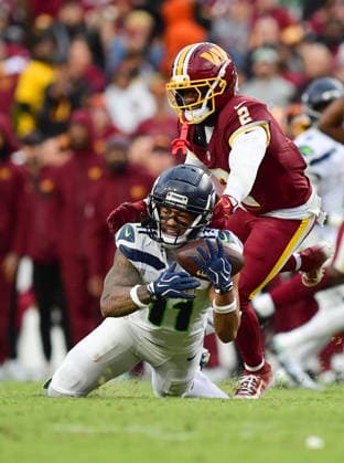 LANDOVER, MD - SEPTEMBER 27: Washington cornerback Amik Robertson (2) tackles Seahawks wide receiver Jaxon Smith-Njigba (11) after a catch during the Seattle Seahawks versus Washington Commanders National Football League game at Northwest Stadium on September 27, 2026 in Landover, MD. (Photo by Randy Litzinger Icon Sportswire) NFL, American Football Herren, USA SEP 27 Seahawks at Commanders EDITORIAL USE ONLY Icon9662609271215