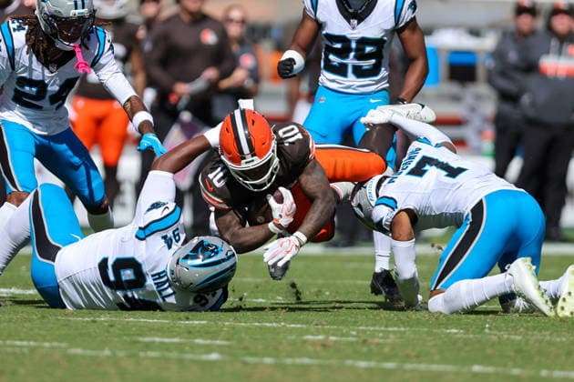 CLEVELAND, OH - SEPTEMBER 27: Cleveland Browns running back Quinshon Judkins (10) is tackled by Carolina Panthers defensive tackle Aaron Hall (94) and Carolina Panthers safety Tre von Moehrig (7) during the second quarter of the National Football League game between the Carolina Panthers and Cleveland Browns on September 27, 2026, at Huntington Bank Field in Cleveland, OH. (Photo by Frank Jansky Icon Sportswire) NFL, American Football Herren, USA SEP 27 Panthers at Browns EDITORIAL USE ONLY Icon260927017