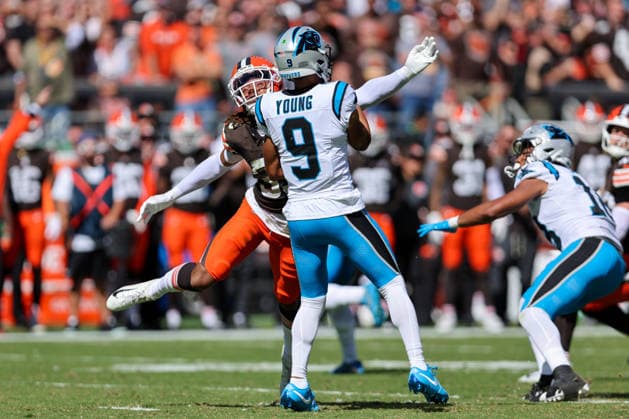 CLEVELAND, OH - SEPTEMBER 27: Carolina Panthers quarterback Bryce Young (9) throws a pass as Cleveland Browns safety Ronnie Hickman (33) applies pressure during the second quarter of the National Football League game between the Carolina Panthers and Cleveland Browns on September 27, 2026, at Huntington Bank Field in Cleveland, OH. (Photo by Frank Jansky Icon Sportswire) NFL, American Football Herren, USA SEP 27 Panthers at Browns EDITORIAL USE ONLY Icon260927020